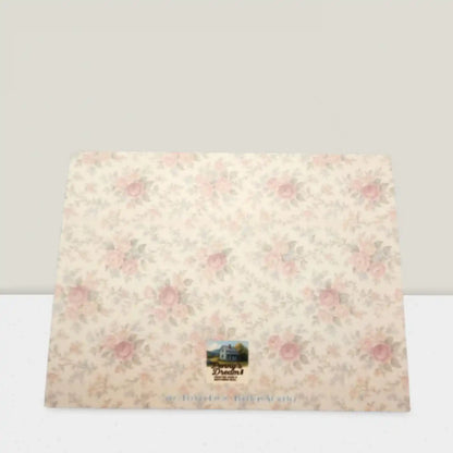 Floral-patterned product with a brand logo on a white background