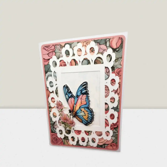 Card with decorative lace border and butterfly illustration on a floral background