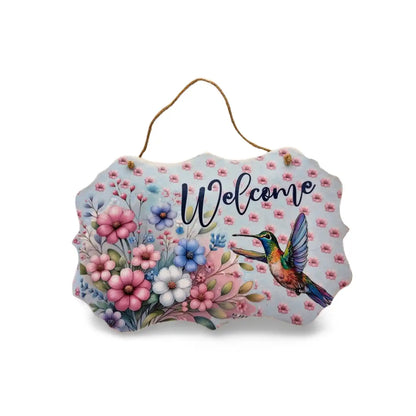 Decorative sign with flowers and a hummingbird, featuring the word 'Welcome'.