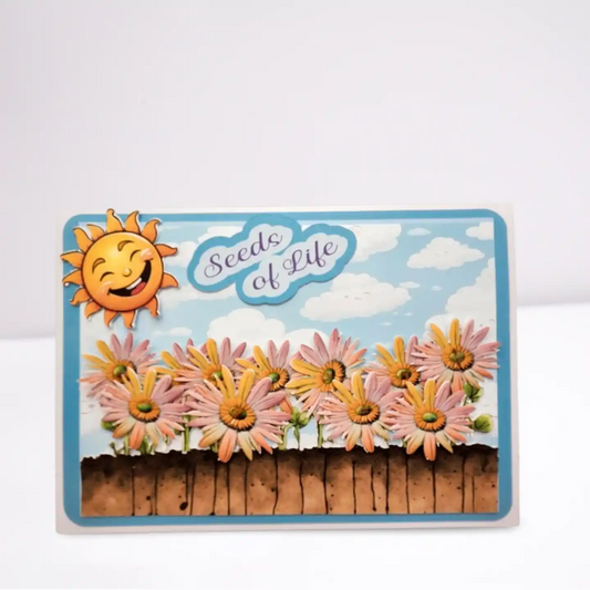 Card with a sun and flowers design labeled 'Seeds of Life' on a white background