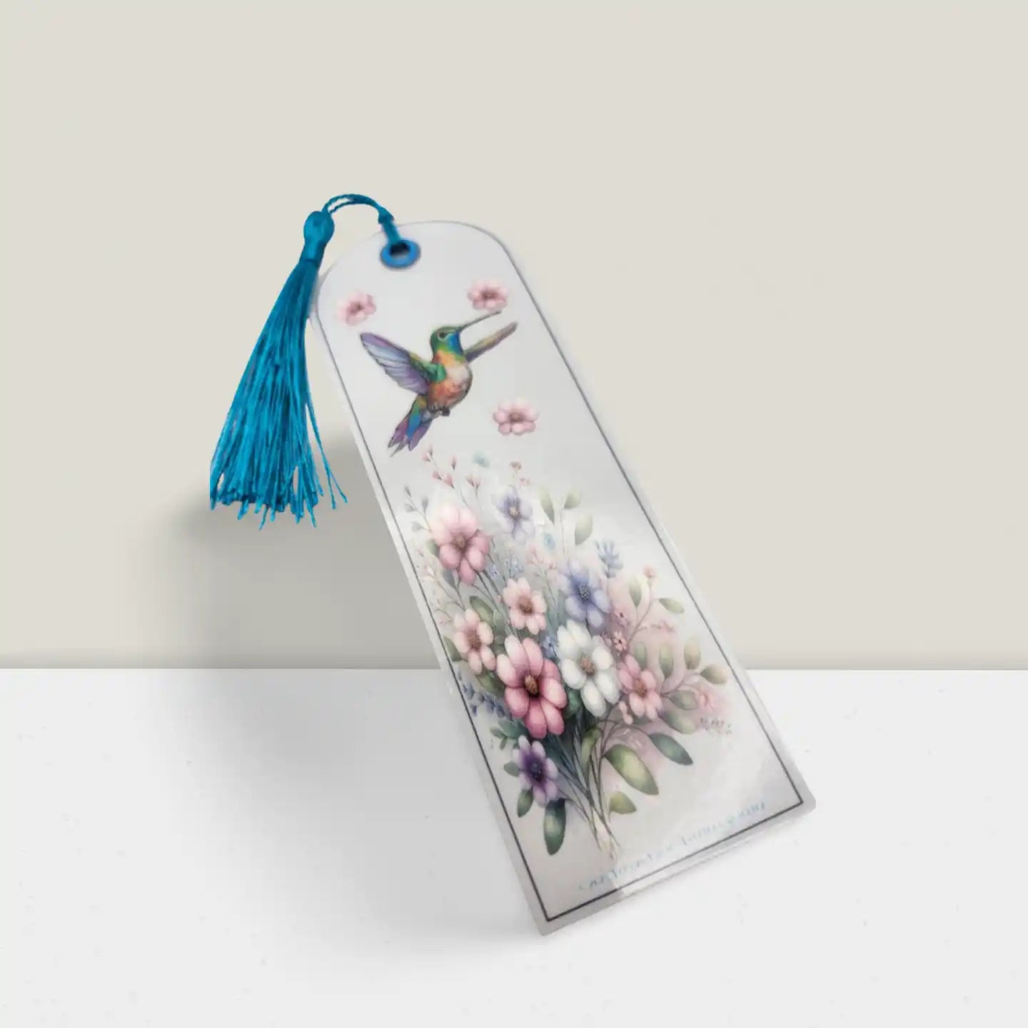 Bookmark with a colorful bird illustration and floral design on a white background