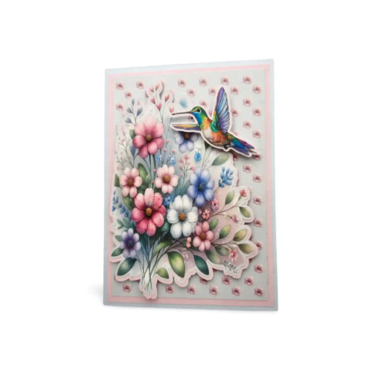 Greeting card with a colorful illustration of a hummingbird and flowers on a white background