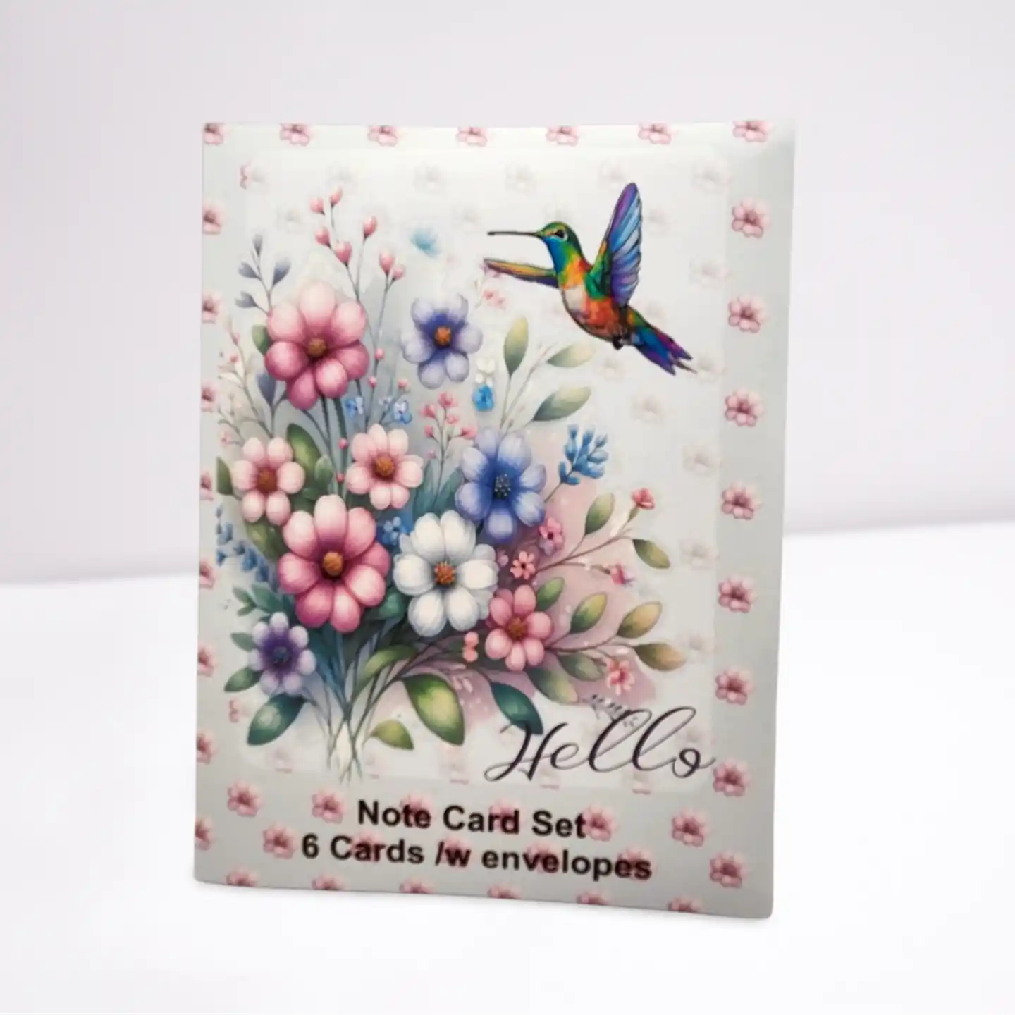 Note card set with floral design and hummingbird on a white background