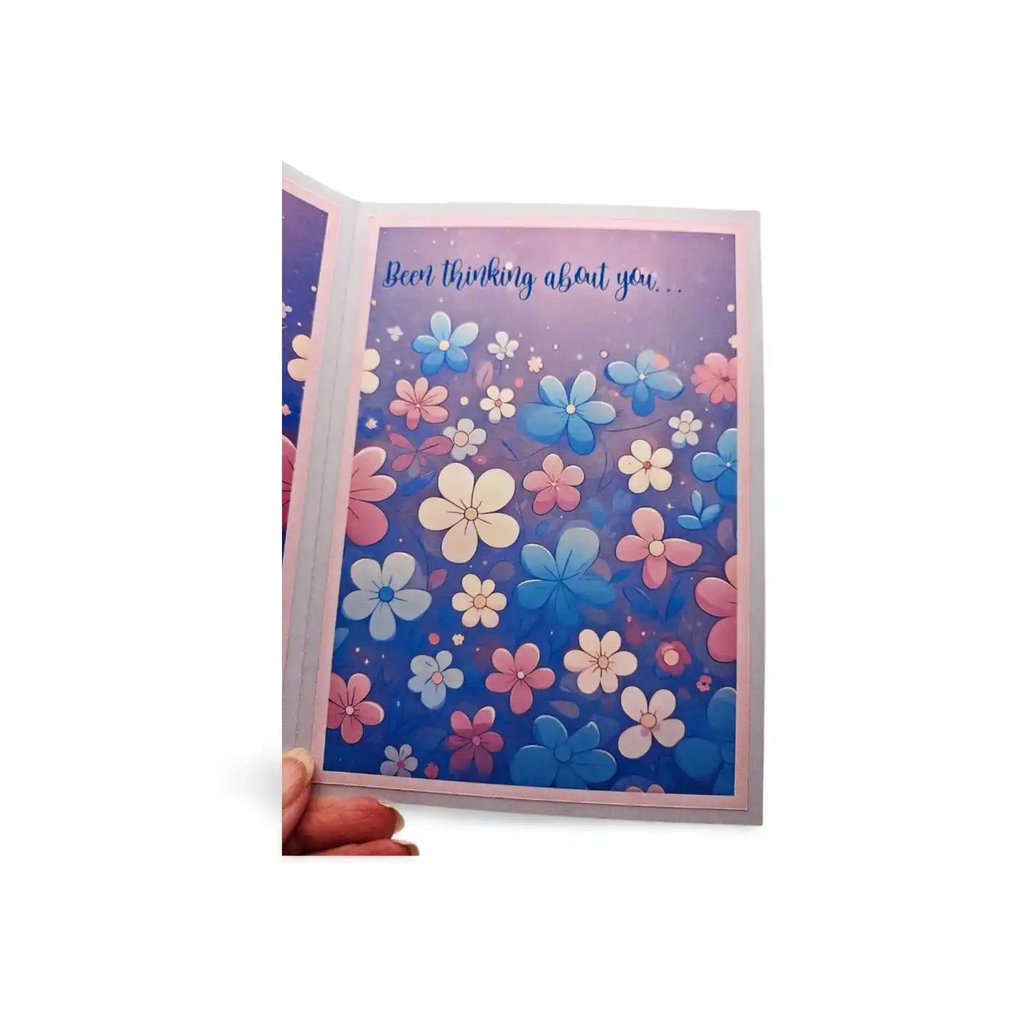 Floral card with 'I'm thinking about you' text on a blue background