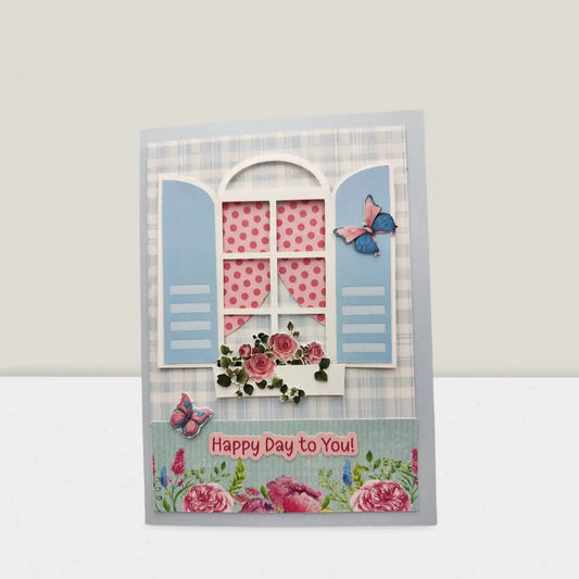 Decorative card with a window design, flowers, and butterflies on a light gray background.