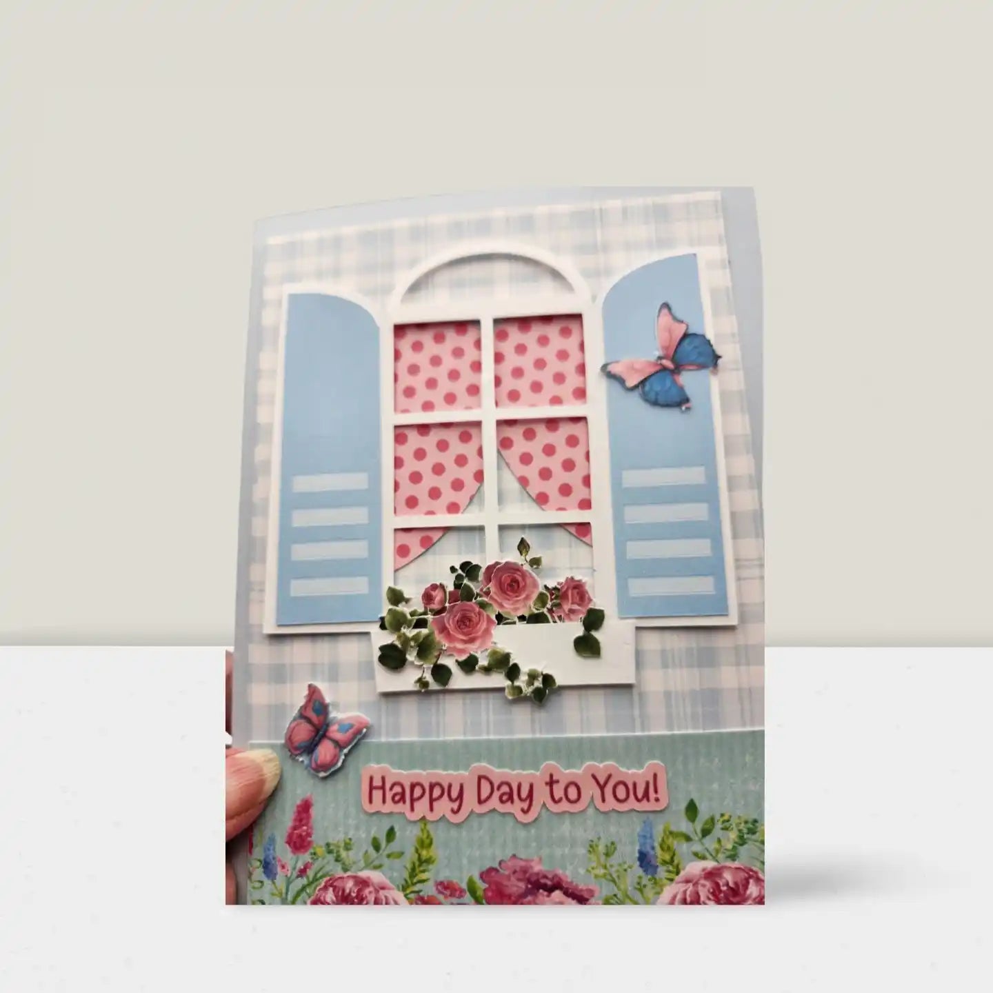 Greeting card with floral design, butterflies, and 'Happy Day to You!' text on a white background.