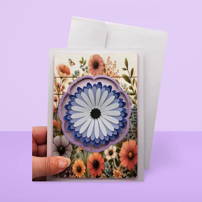 Greeting card with floral design and a hand holding it against a purple background