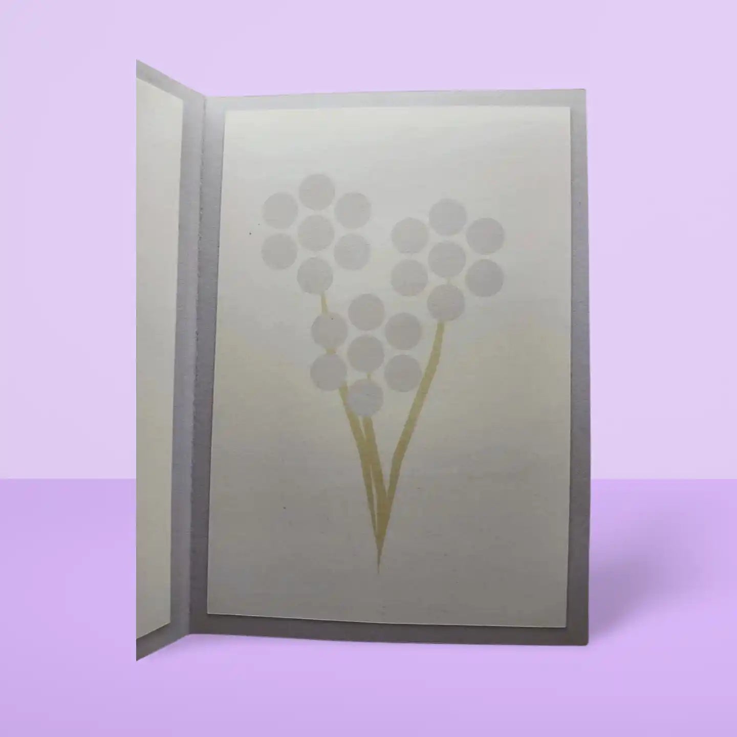 Card with floral design on a light purple background