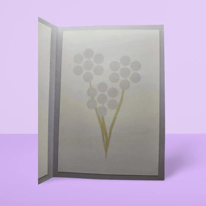 Card with floral design on a light purple background