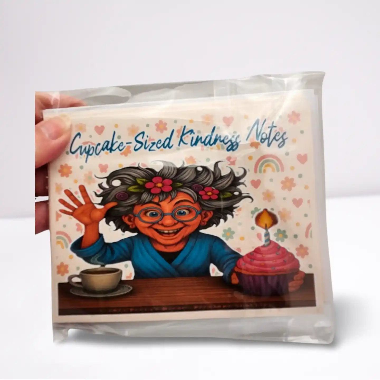 Pack of 'Cupcake-Sized Kindness Notes' with a colorful illustration of a character holding a cup and a cake.