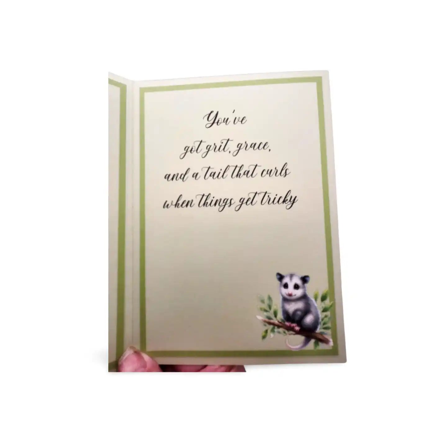 Card with an opossum illustration and humorous text on a white background