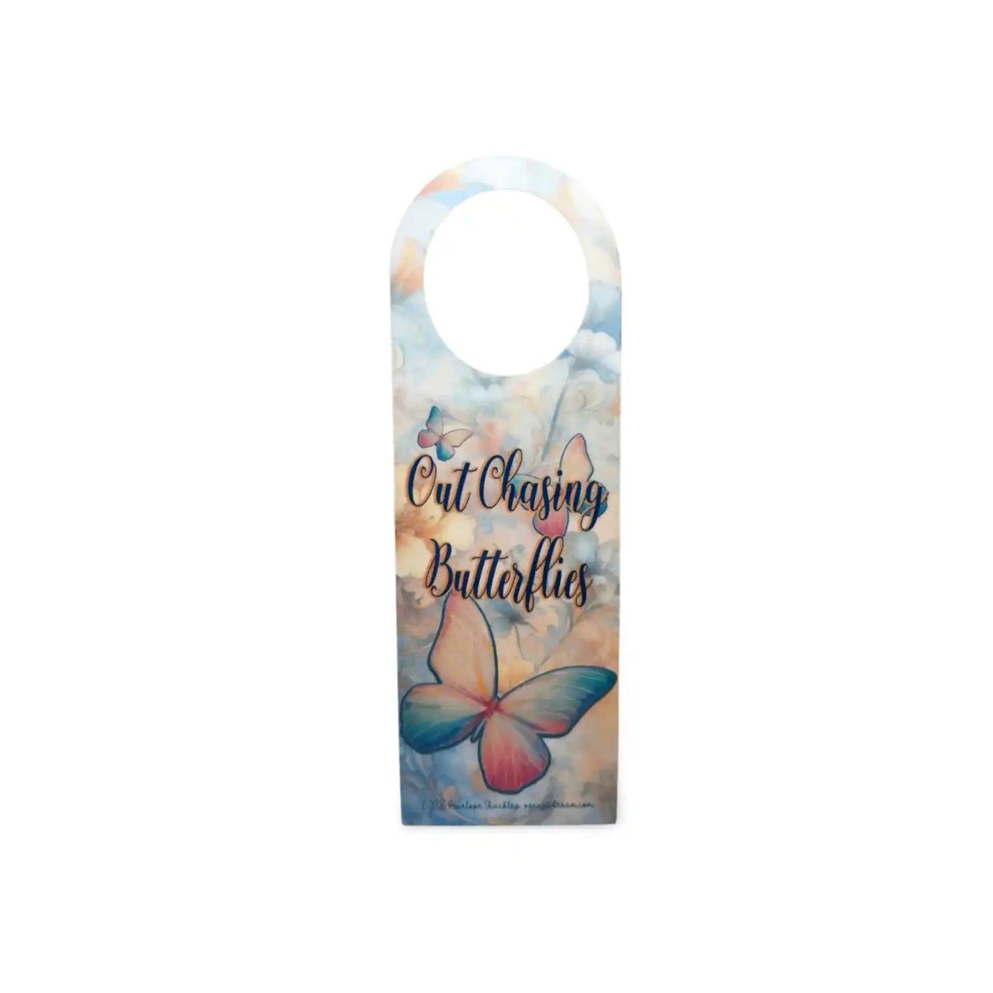 Decorative door hanger with butterfly design and text on a white background