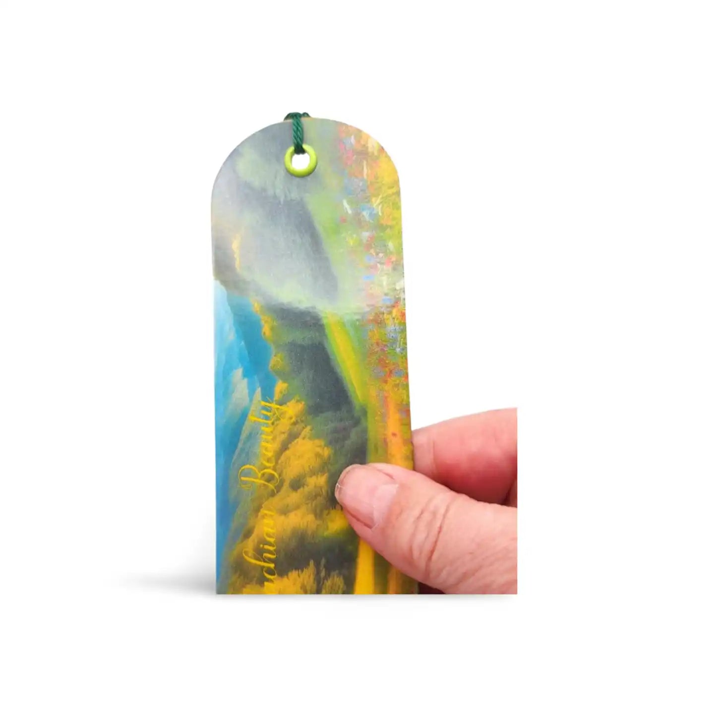 Colorful bookmark held by a hand on a white background