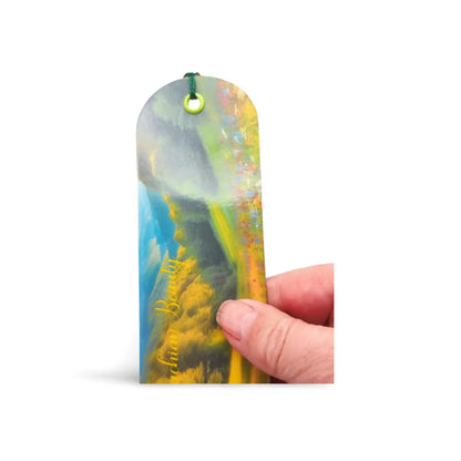 Colorful bookmark held by a hand on a white background