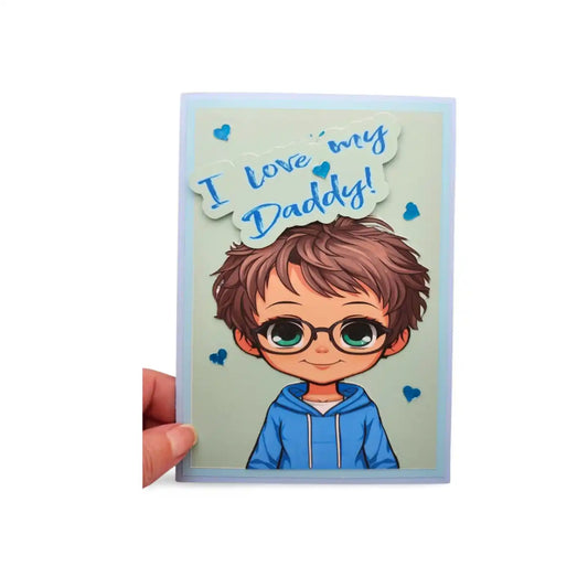 Card with a cartoon boy wearing glasses and a blue hoodie, and text 'I love my Daddy!' on a light blue background.