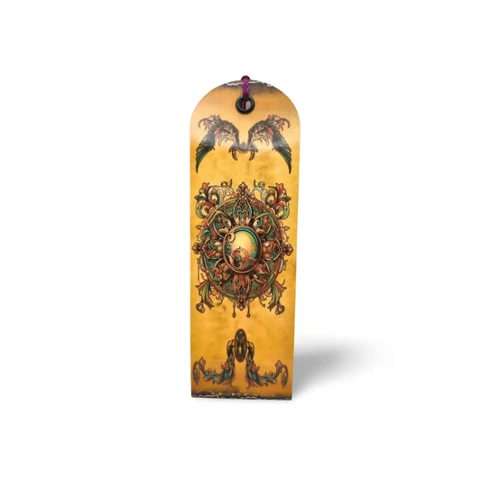 Decorative wooden plaque with intricate designs on a white background