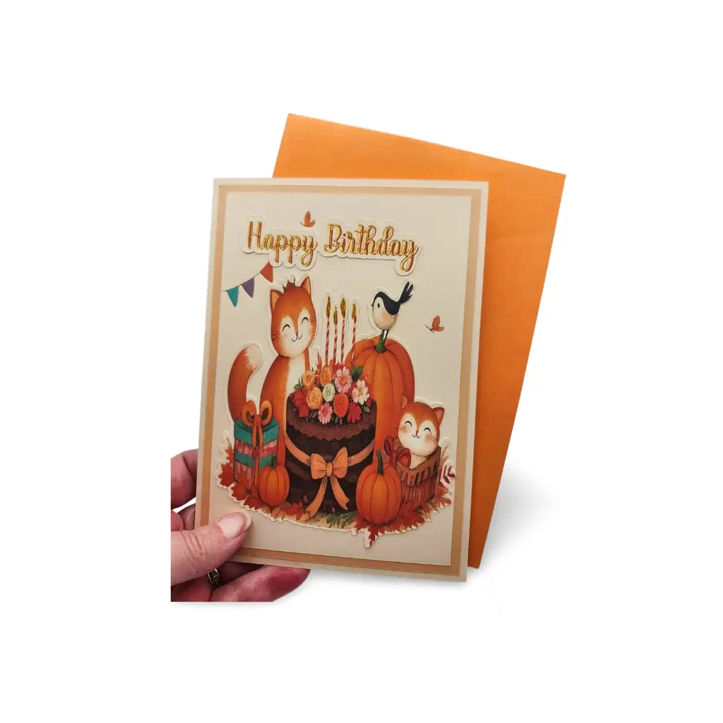 Birthday card with autumn-themed illustration of a cake, pumpkins, and animals on an orange envelope.