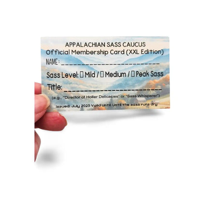 Appalachian Sass Caucus membership card held by a hand with mountain background