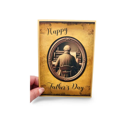Father's Day card with vintage-style illustration of a man playing piano, held by a hand on a white background.