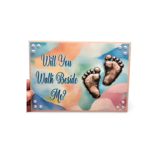 Card with footprints and 'Will You Walk Beside Me?' text on a colorful background