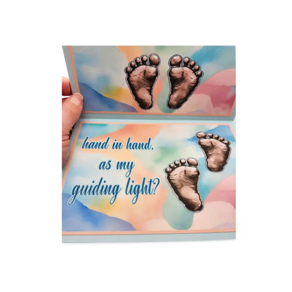 Greeting card with footprints and text 'hand in hand, as my guiding light?' on a colorful background.