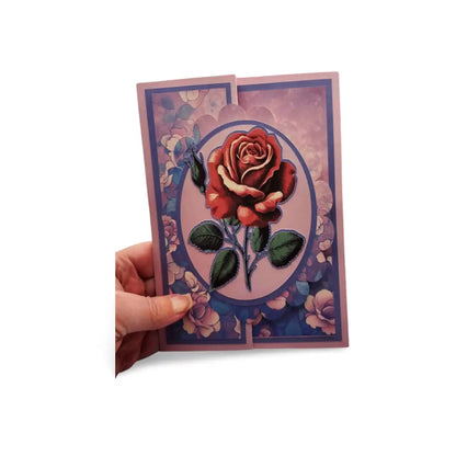 Card with a red rose design held by a hand on a white background