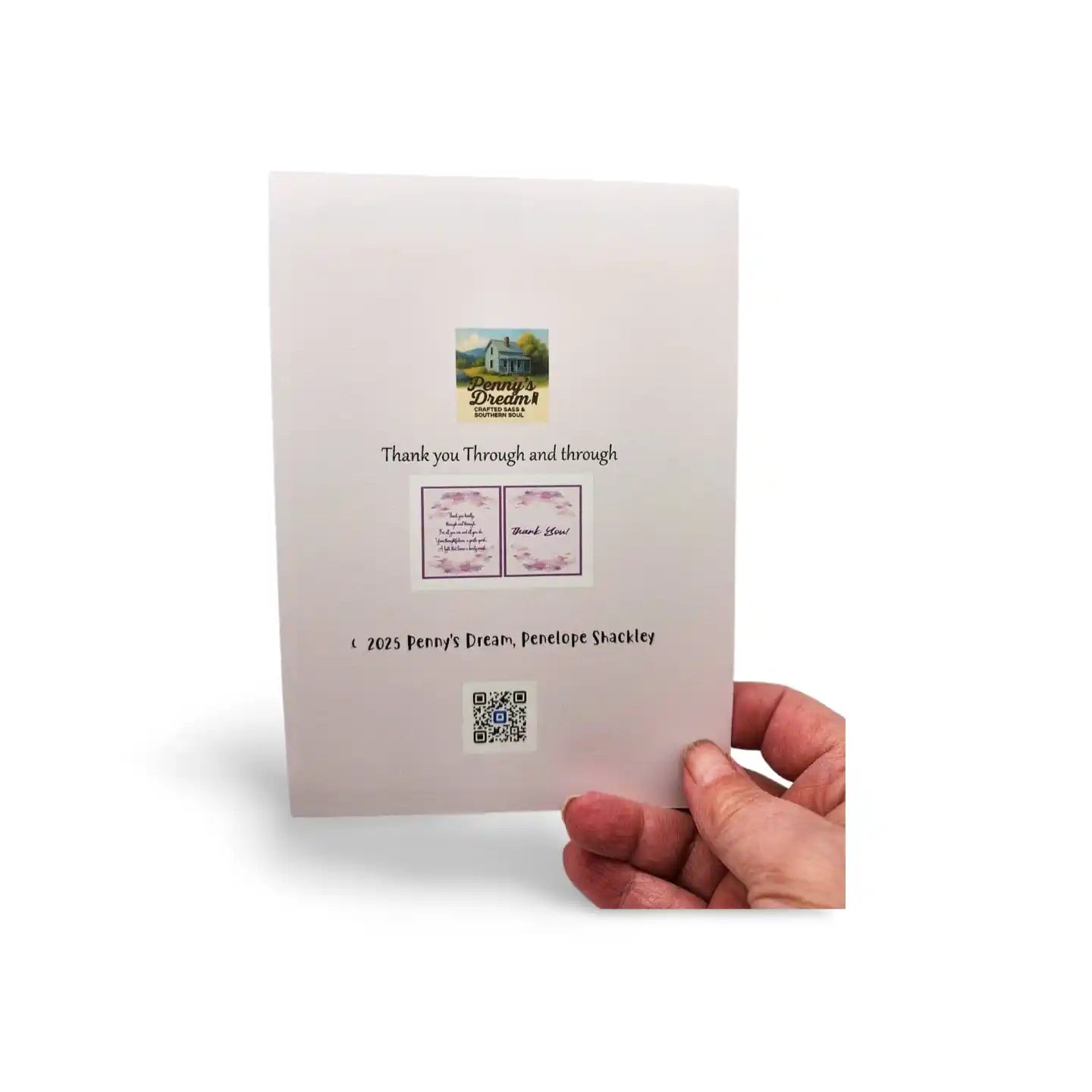 Hand holding a card with a QR code and text on a white background