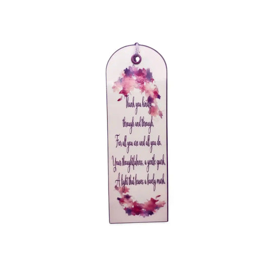 Decorative bookmark with floral design and text on a white background