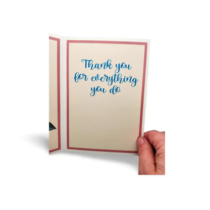 Hand holding a card with 'Thank you for everything you do' text on a white background