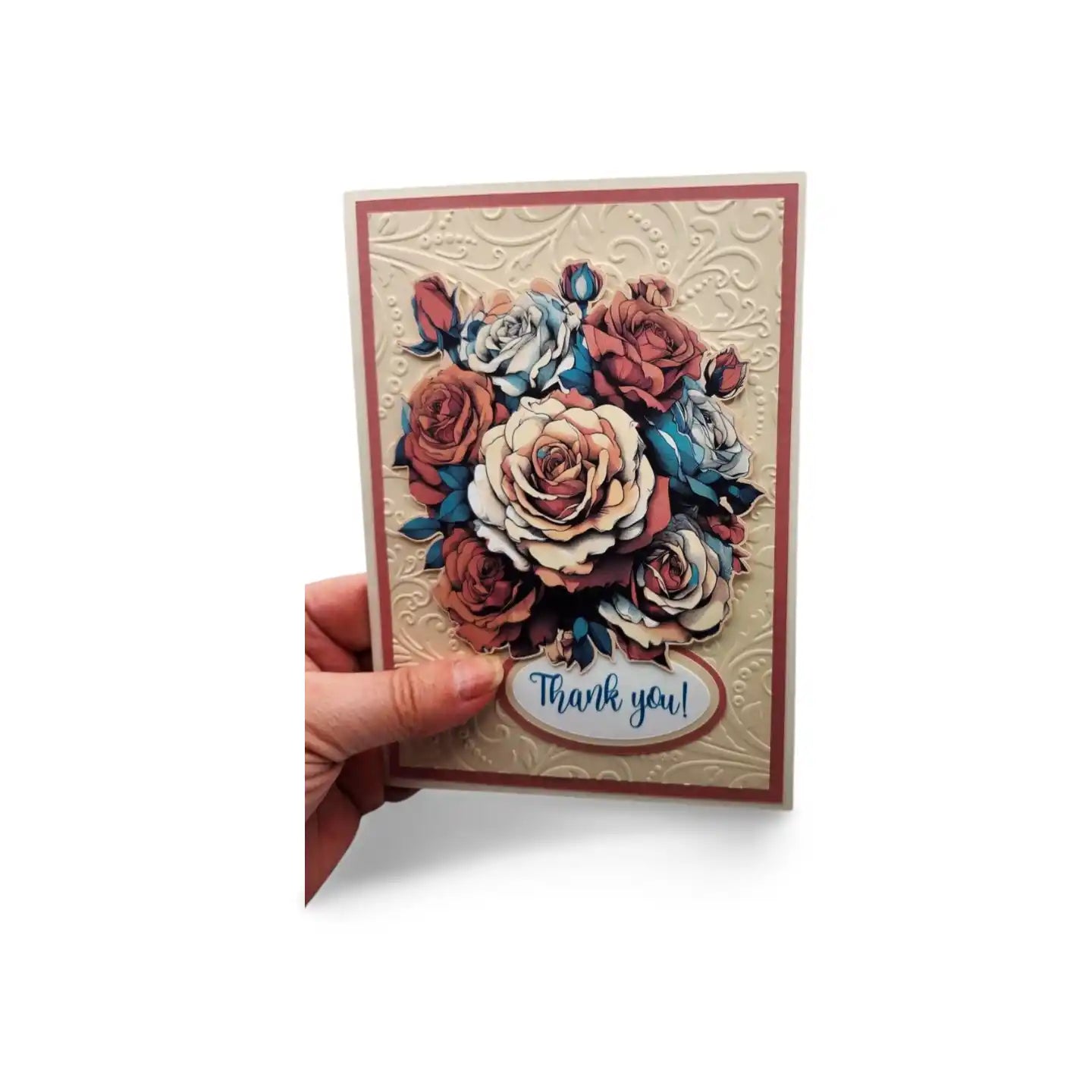 Card with floral design and 'Thank you!' text held by a hand on a white background