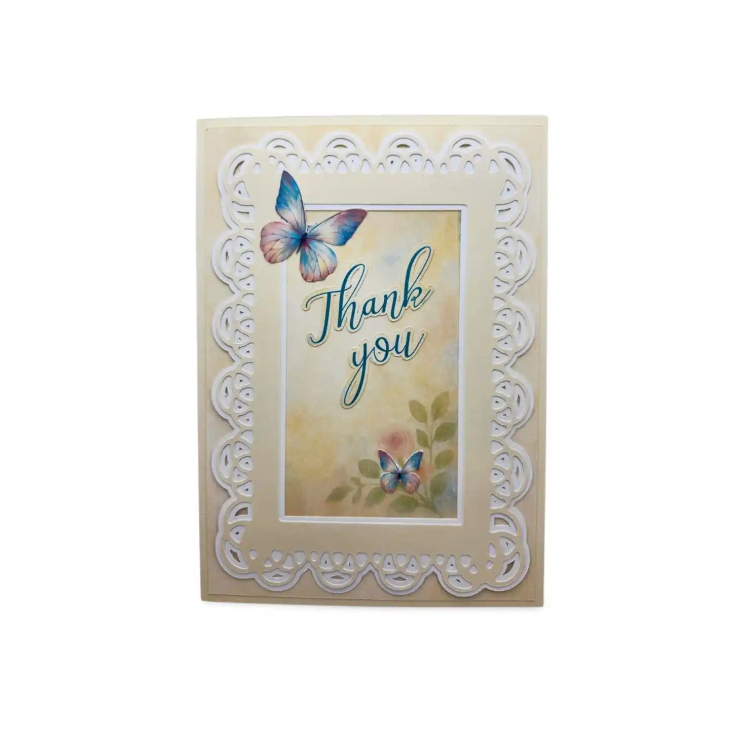 Greeting card with butterflies and 'Thank you' text on a decorative frame.
