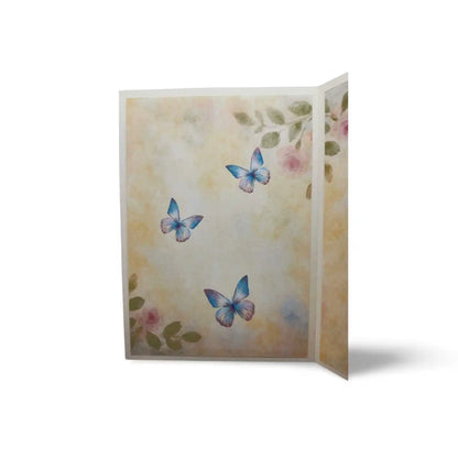 Folded card with butterflies and floral design on a white background