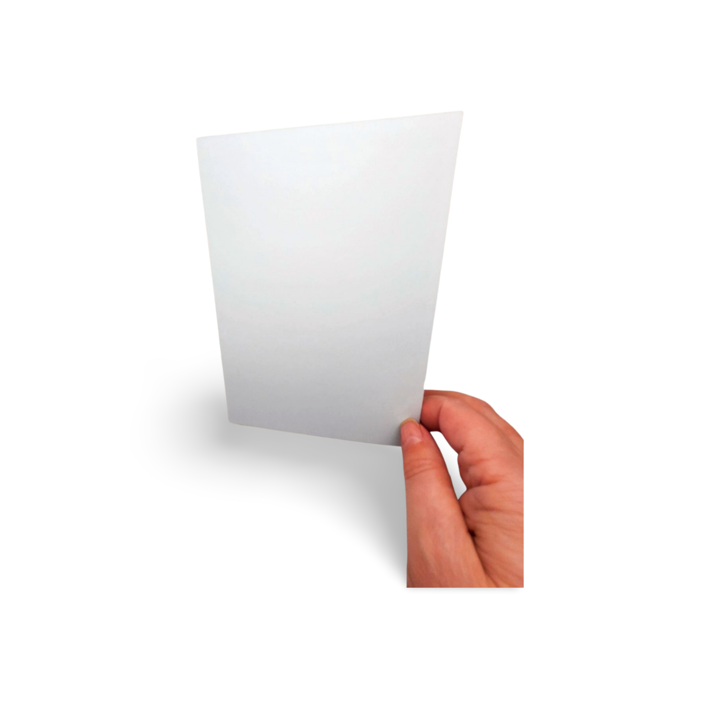 Hand holding a white card against a white background