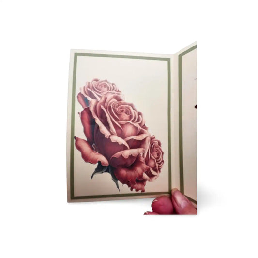 Greeting card with a pink rose design on a white background