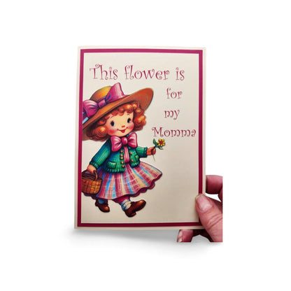 Card with illustration of a girl holding a flower and text 'This flower is for my Momma' on a white background