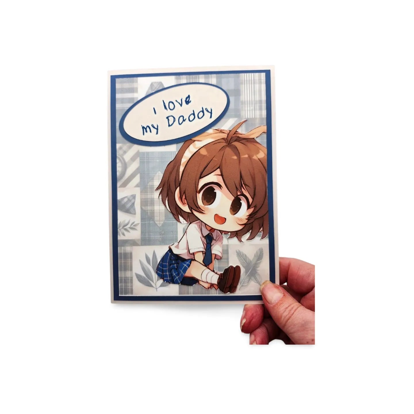 Card with cartoon character saying 'I love my Daddy' held by a hand on a white background
