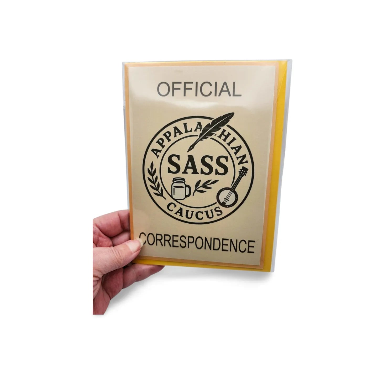 Hand holding a card with 'Official Appalachian SASS Caucus Correspondence' text and logo.