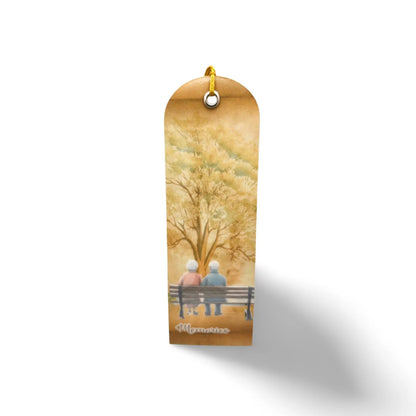 Decorative bookmark with a couple on a bench under a tree, on a white background