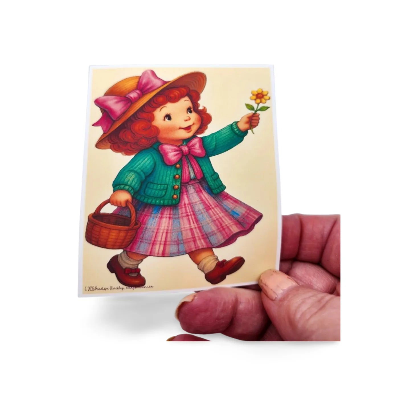Illustration of a girl holding a flower and a basket, held by a hand on a white background