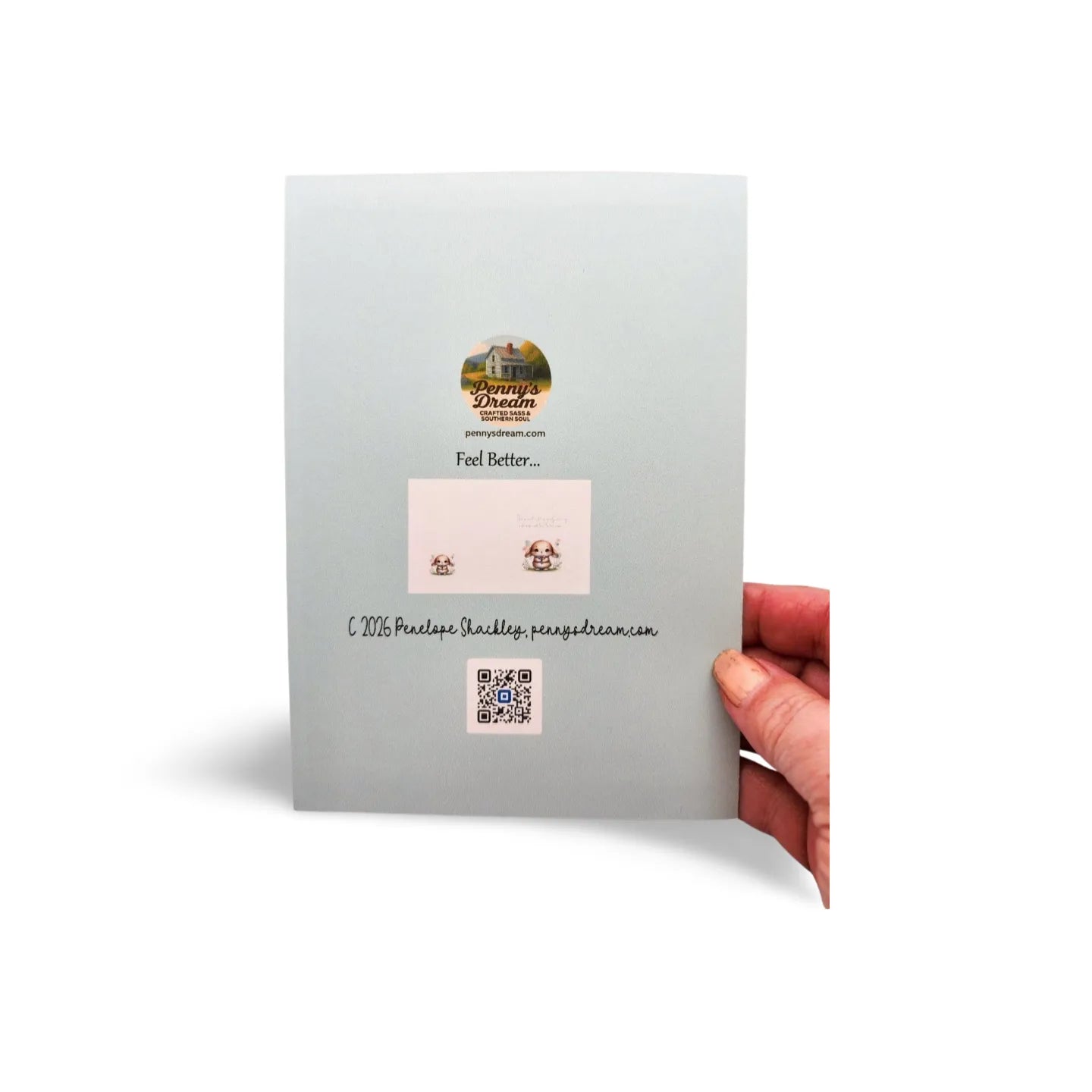 Card with earring display and QR code held by a hand on a white background