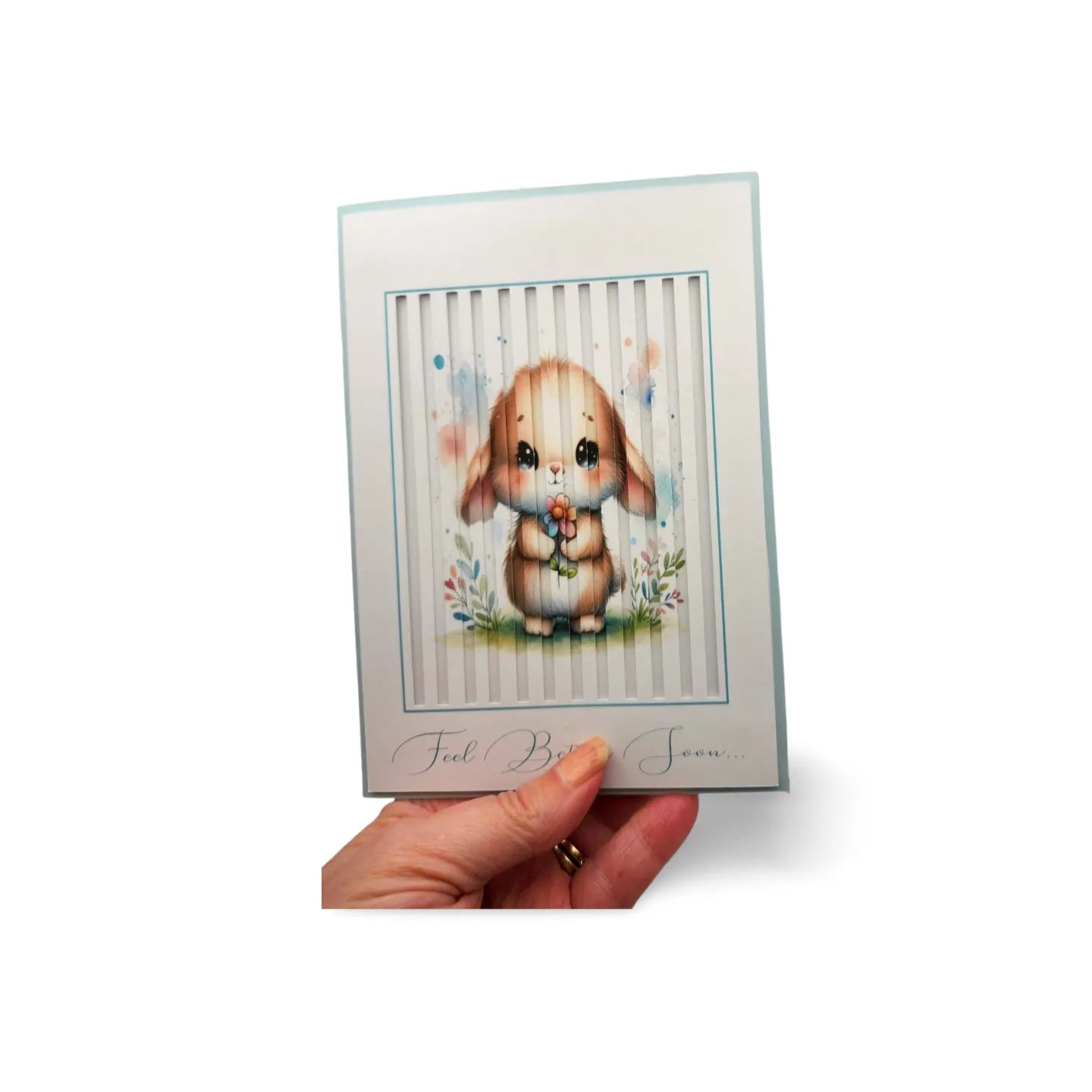 Hand holding a card with a cute bunny illustration on a white background
