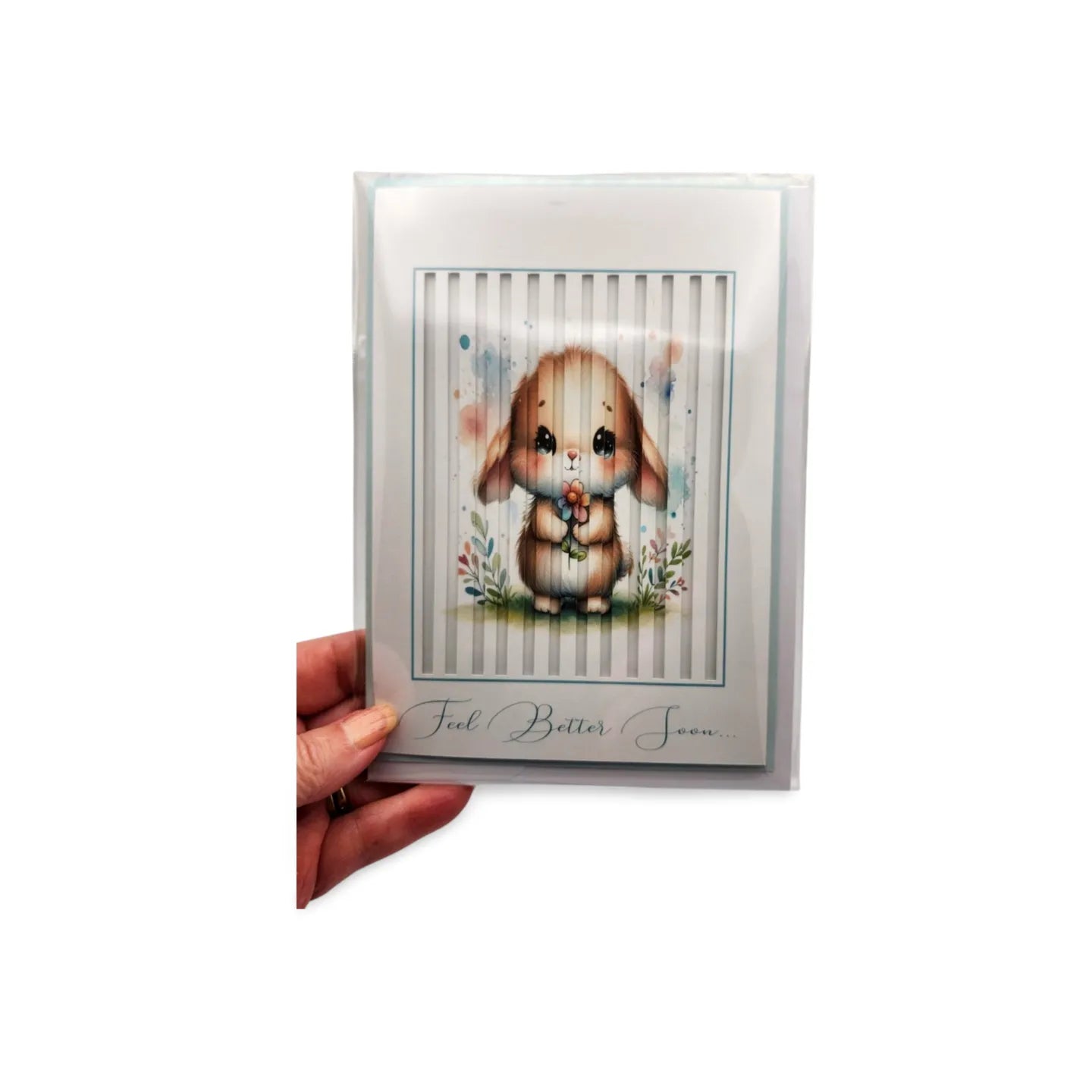 Card with a bunny illustration and 'Feel Better Soon' text, held by a hand on a white background.