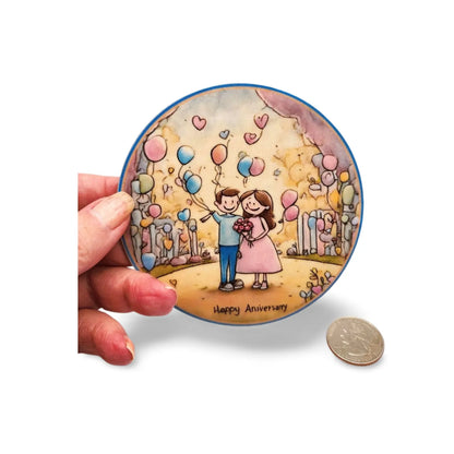 Circular illustration of a couple with balloons held by a hand, with a coin for scale on a white background.