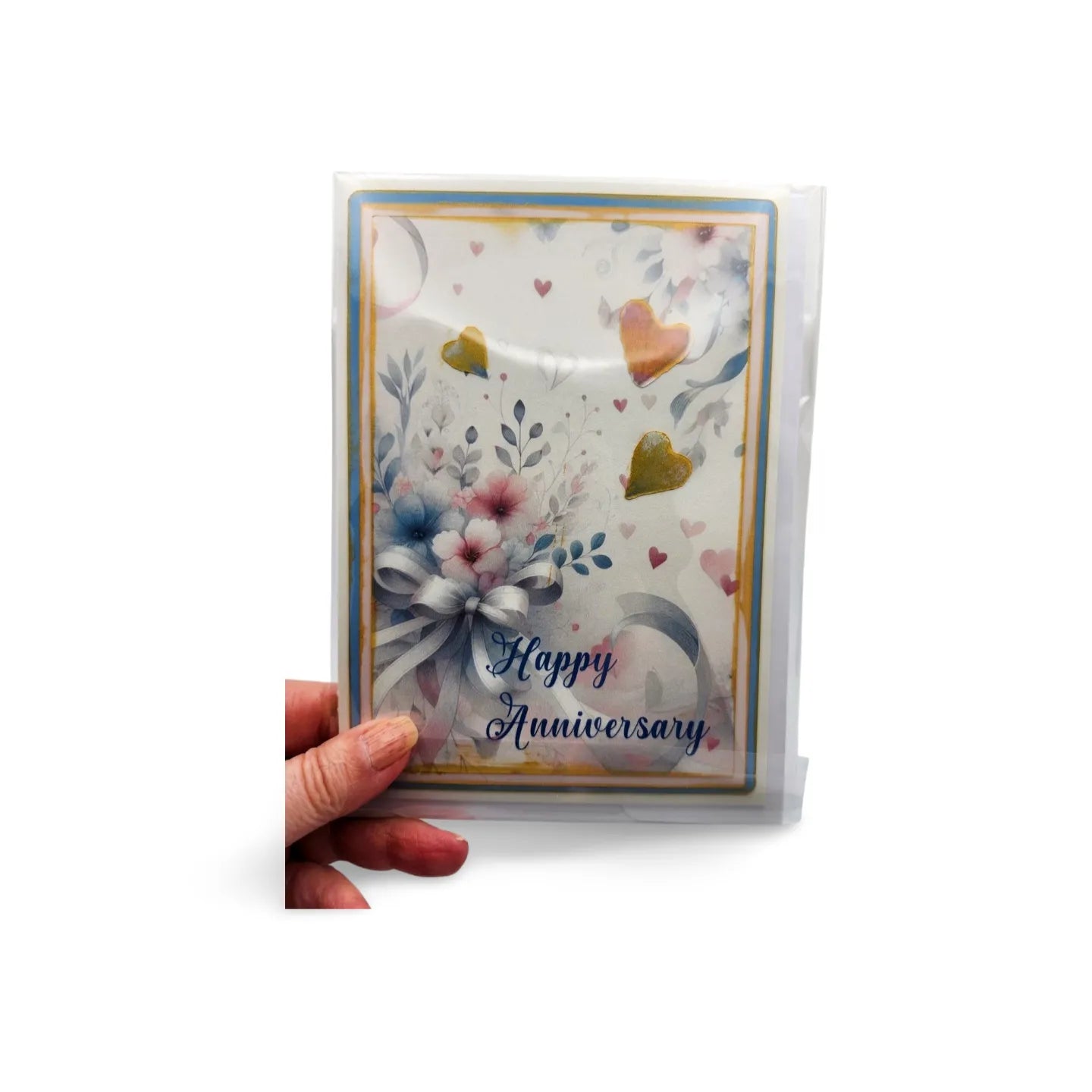 Card with floral design and 'Happy Anniversary' text held by a hand on a white background