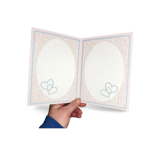 Hand holding a card with two heart designs on a white background