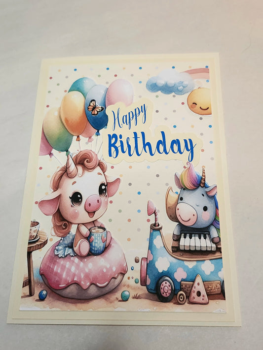 Birthday card with cartoon unicorn and elephant, colorful balloons, and 'Happy Birthday' text.