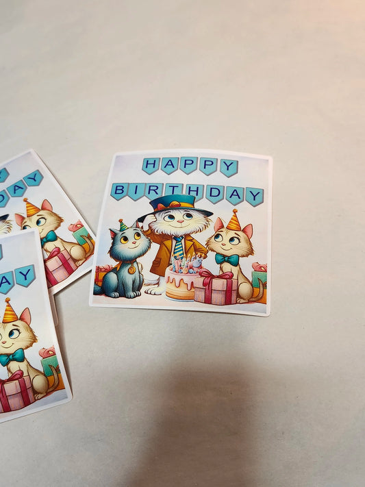 Two birthday cards with cartoon cats on a light gray background