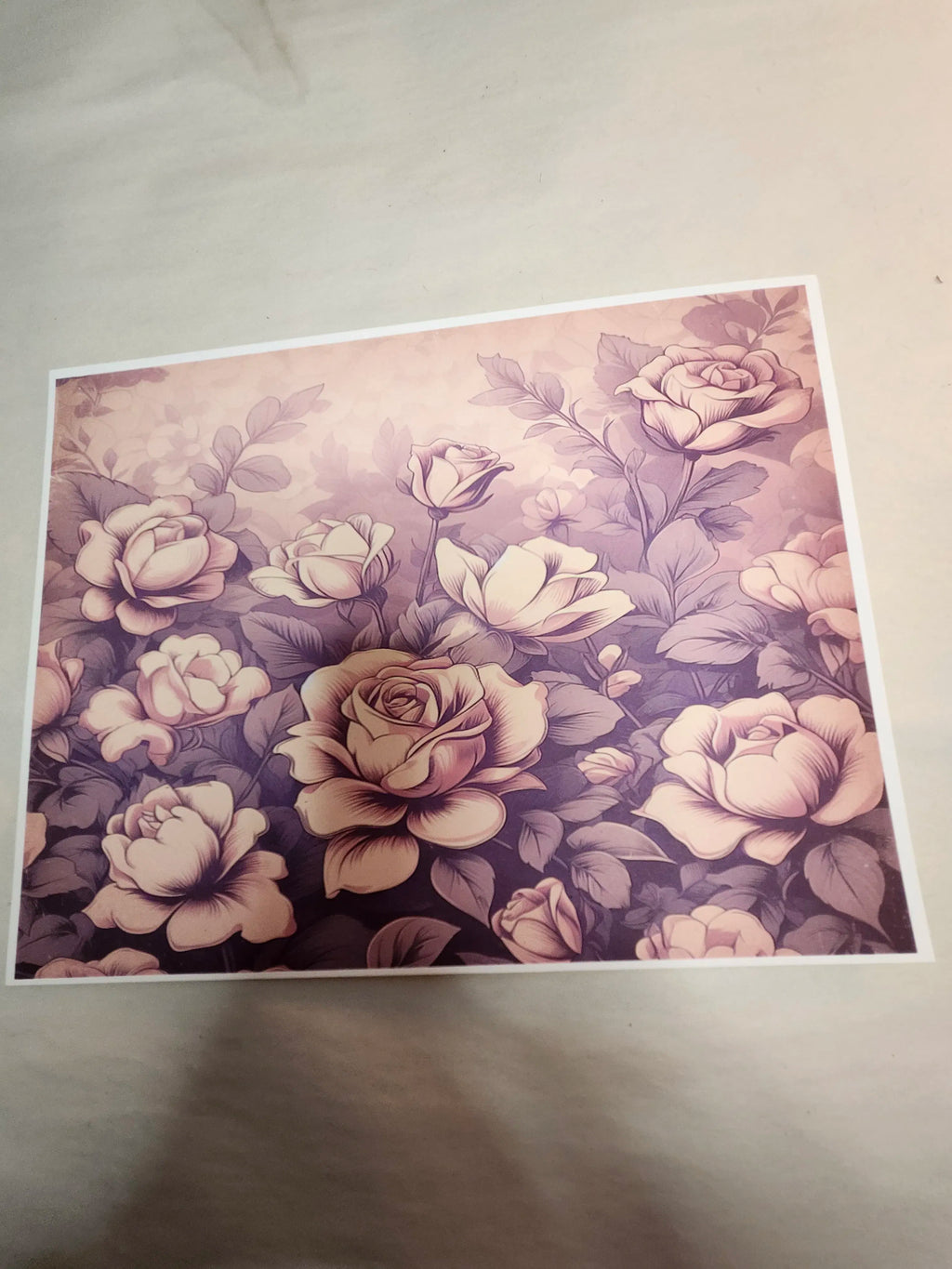 Floral patterned paper with roses on a plain background