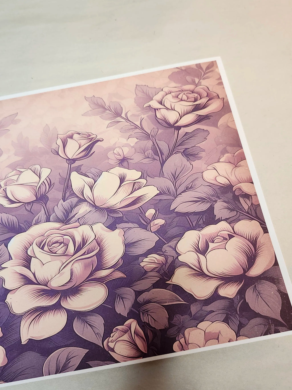 Floral patterned paper with roses on a plain background