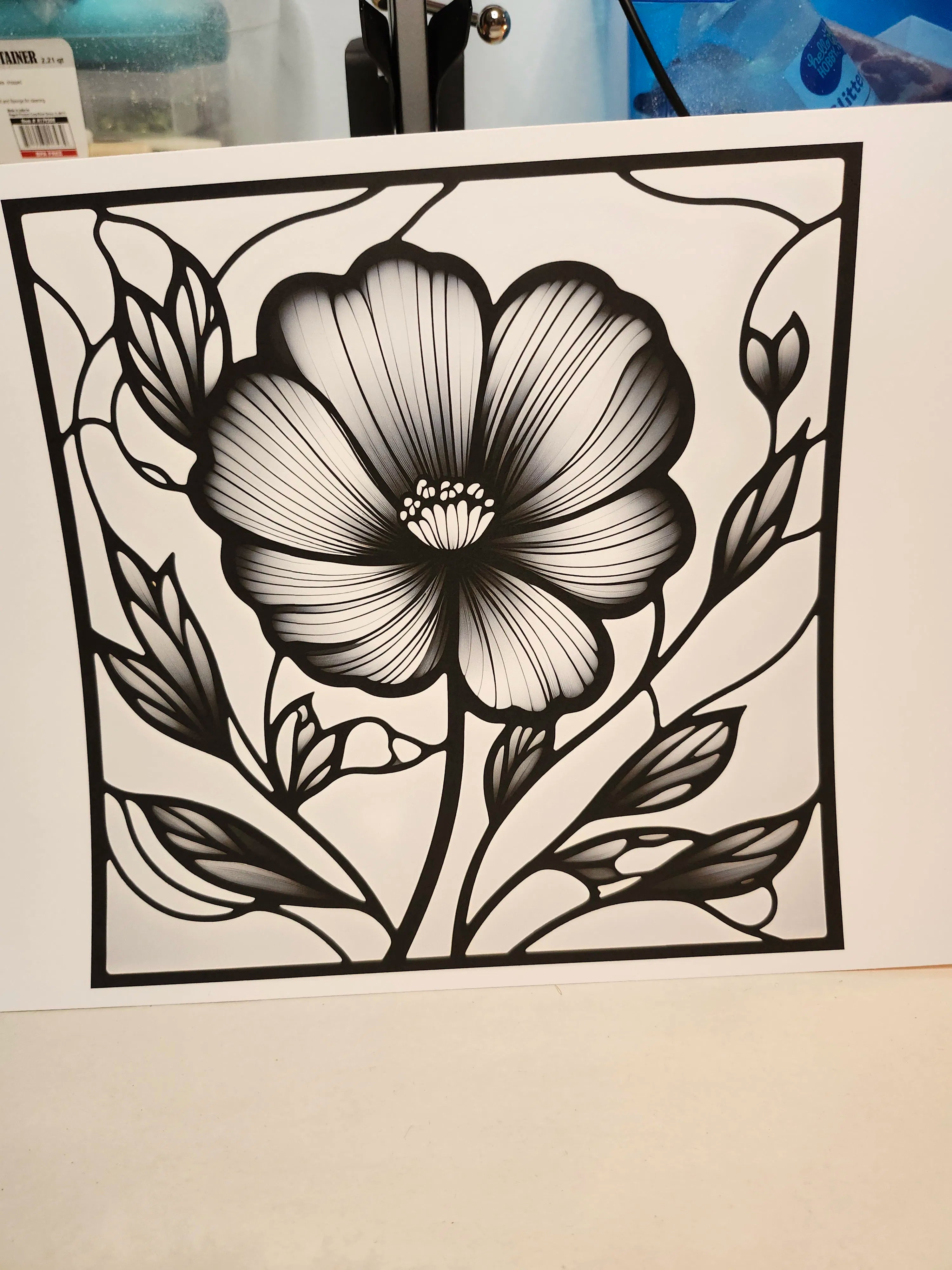 Black floral design on a white background